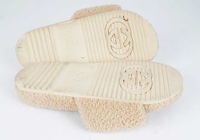GUCCI X NORTH FACE
Beige sheepskin sandals...