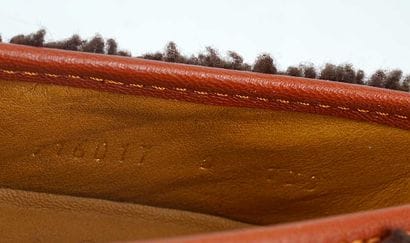 GUCCI 
Brown sheepskin loafers trimmed with...