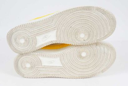 NIKE 
Yellow leather Air Force 1 LV8 sneakers...