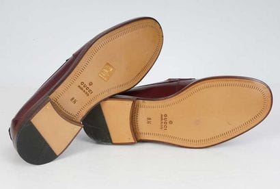GUCCI
Burgundry leather penny loafers. 
Men's...