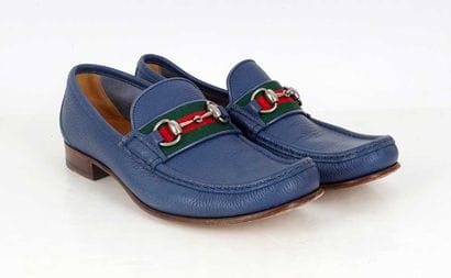GUCCI 
Blue leather penny loafers featuring...