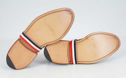 THOM BROWNE
Black leather lace-up brogue...