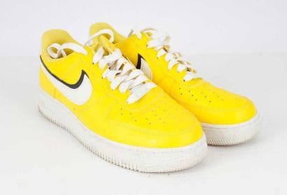 NIKE 
Yellow leather Air Force 1 LV8 sneakers...