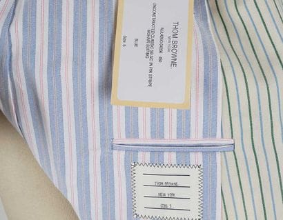 THOM BROWNE
Light green tailored jacket with...