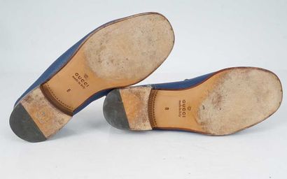 GUCCI 
Blue leather penny loafers featuring...
