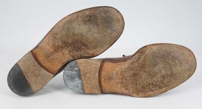 GUCCI 
Brown croco-style leather penny loafers...