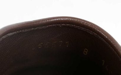 GUCCI
Brown canvas mules featuring the GG...