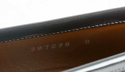 GUCCI
Gray patent leather loafers featuring...