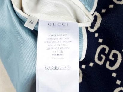 GUCCI 
Navy blue wool blazer trimmed with...