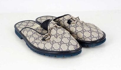 GUCCI
Grey canvas mules featuring the GG...