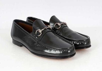 GUCCI
Gray patent leather loafers featuring...