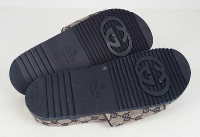 GUCCI
Beige monogrammed canvas sandals with...