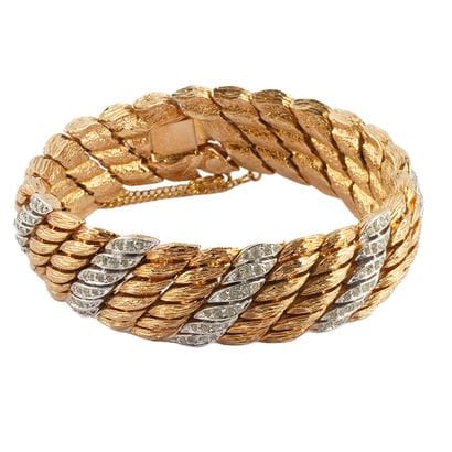 FANTAISIE
Bracelet large en métal doré et...