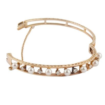 OR 14K, DIAMANTS, PERLES
Bracelet ouvrant...