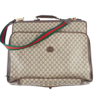 GUCCI
Porte-vetêments Gucci en toile monogrammé...