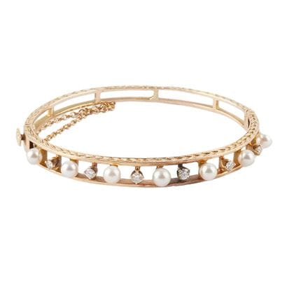 OR 14K, DIAMANTS, PERLES
Bracelet ouvrant...