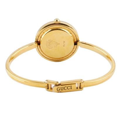 GUCCI
Montre- bracelet Gucci en métal doré,...