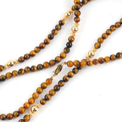 ŒIL DE TIGRE, OR 10K
Collier composé de perles...