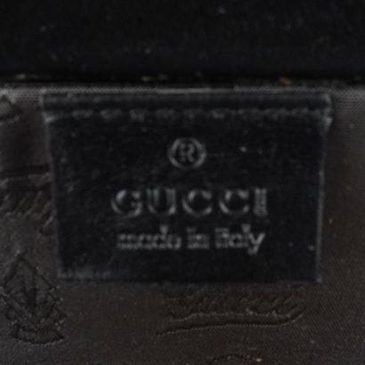 GUCCI
Valise Gucci en cuir noir.
Rapport...