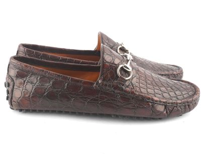 GUCCI
Mocassins Gucci en cuir marron embossé.
Taille:...
