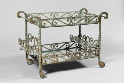 WORK OF THE 1950's Wrought iron rolling table,...