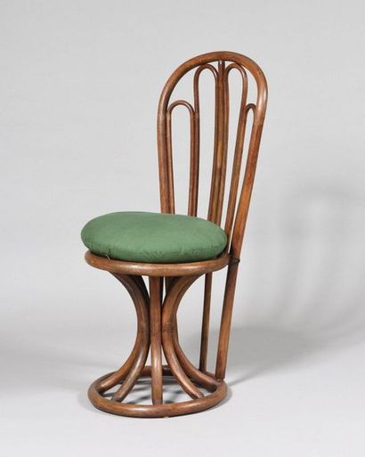 WORK OF THE 1960's Rattan chair with circular...