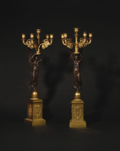 Pair of patinated and gilded bronze candelabra...