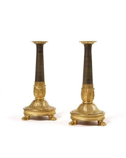 Pair of gilt bronze candleholders decorated...