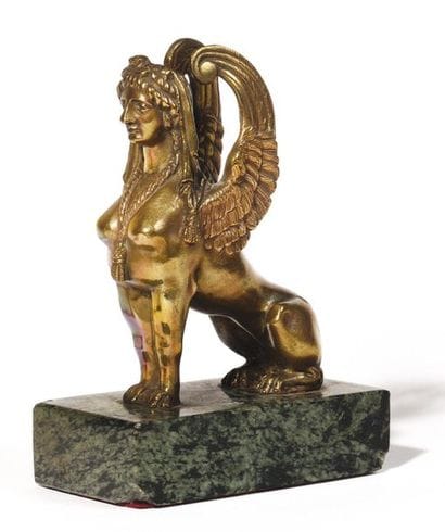 Bronze sphinx on green marble base. Ht.:...