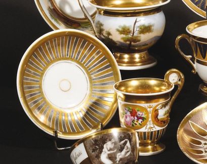Paris Two high-handled cups and their saucer...