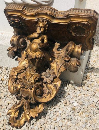 Moulded and carved gilded wood sconce with...