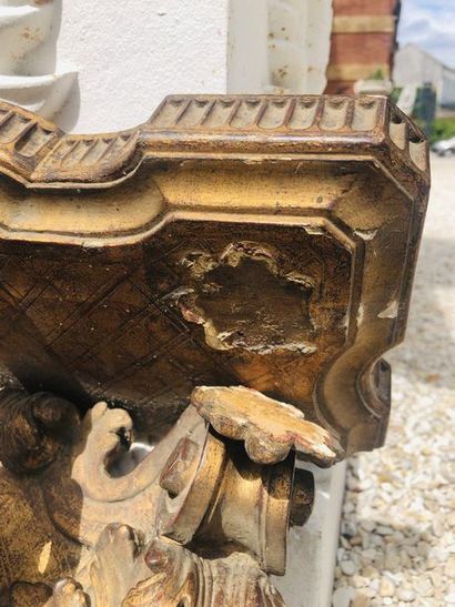 Moulded and carved gilded wood sconce with...
