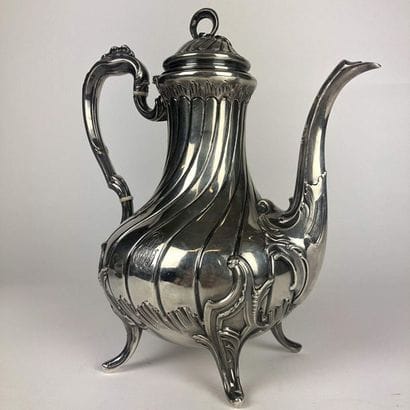 Silver teapot chiselled with wavelets and...
