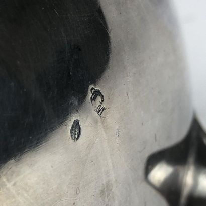 Silver teapot chiselled with wavelets and...