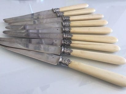 Nine dessert KNIFES, silver blade. Hallmark...