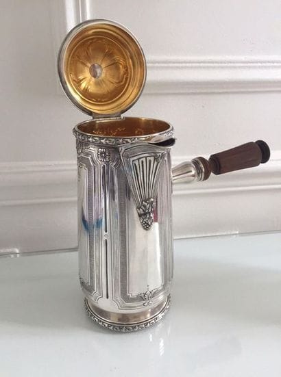 CHOCOLATE silver chiselled with floral frames...