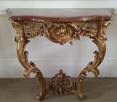 CONSOLE en bois doré de forme mouvementée...