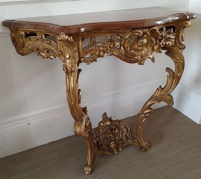 CONSOLE en bois doré de forme mouvementée...