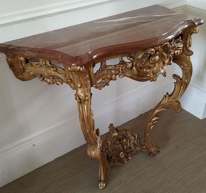 CONSOLE en bois doré de forme mouvementée...