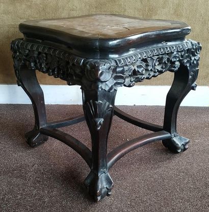 CHINA A hardwood and patinated selette, the...