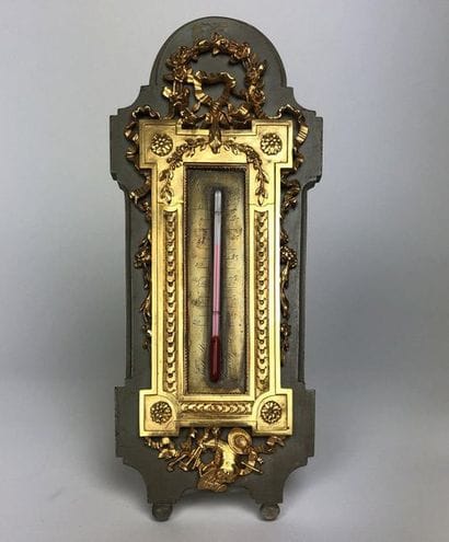THERMOMETER in chased and gilt bronze with...