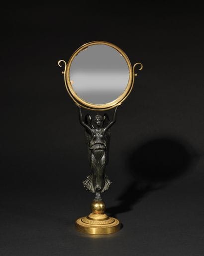 MIROIR DE TABLE en bronze doré et patiné....