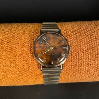 ENICAR Gold-plated wristwatch. Marbled brown...