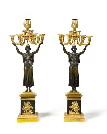 
Pair of patinated and gilded bronze CANDELABRES...