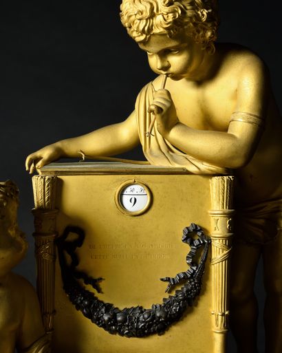 
-PENDULE en bronze doré représentant deux...