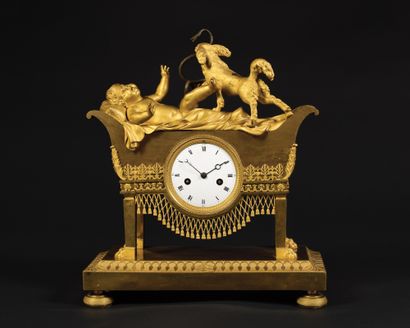
A gilt bronze hanging lamp representing...