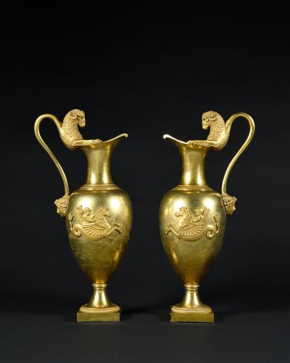 A Pair of ovoid gilt bronze ewers, the body...