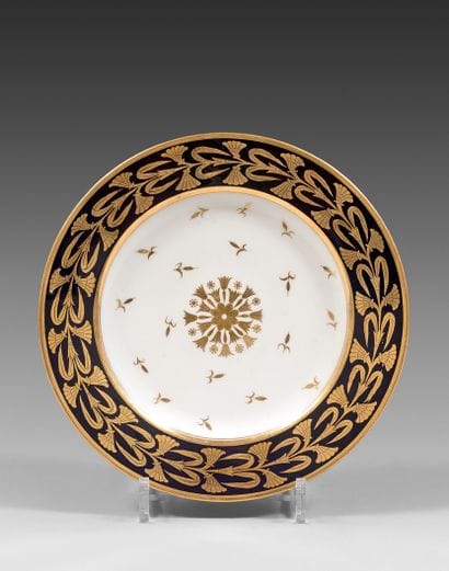 SÈVRES Porcelain plate decorated with a gold...