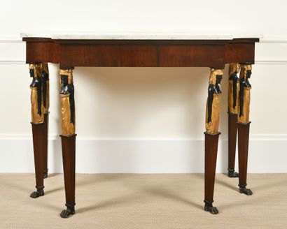 A mahogany CONSOLE TABLE, gilded and patinated...