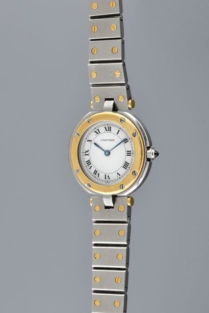 CARTIER 

Santos Round.

Circa: 2000.

Gold...